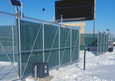 A fence with solar panels on top